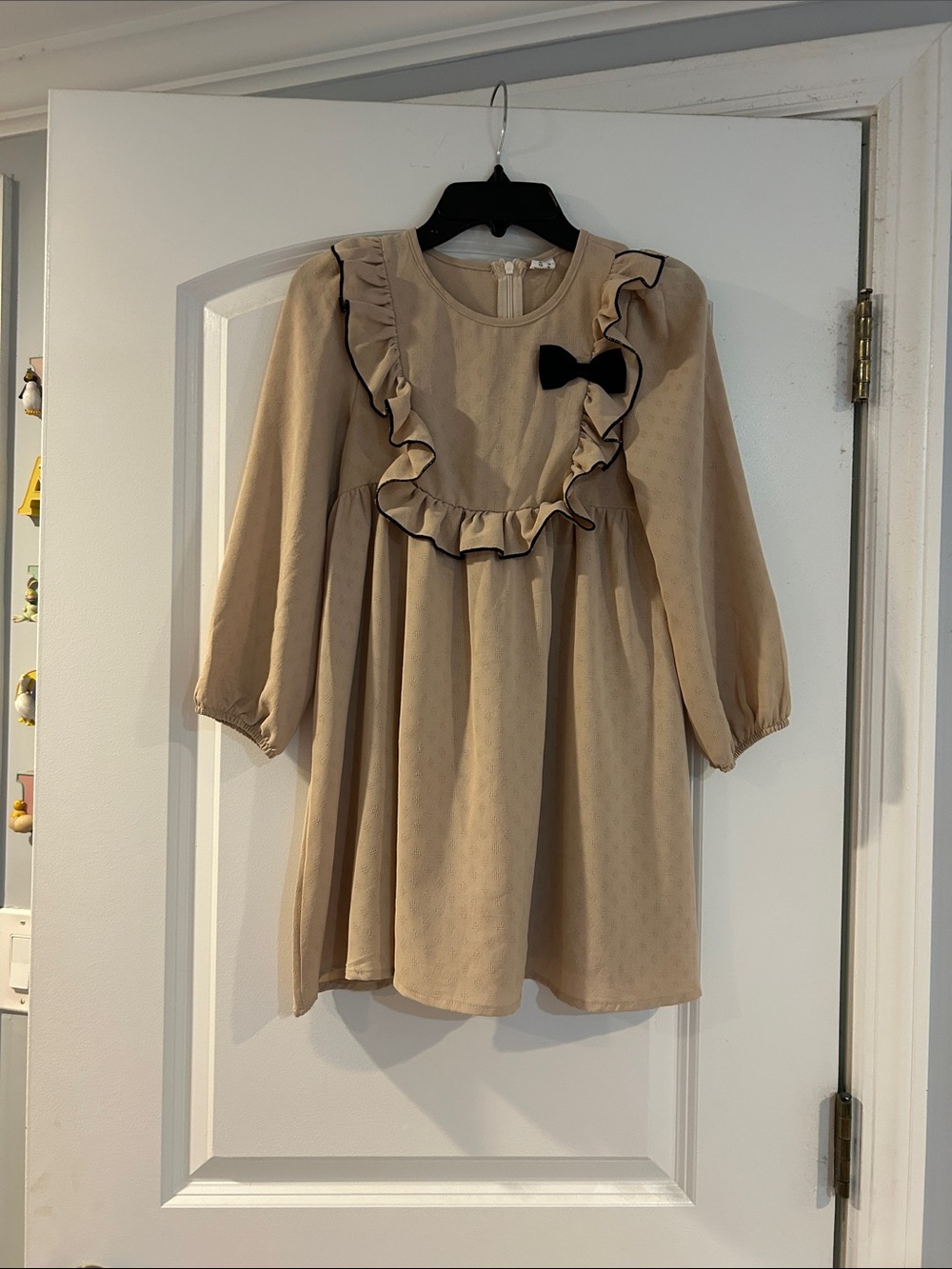 Girls Beige Ruffle Dress with Black Bow
